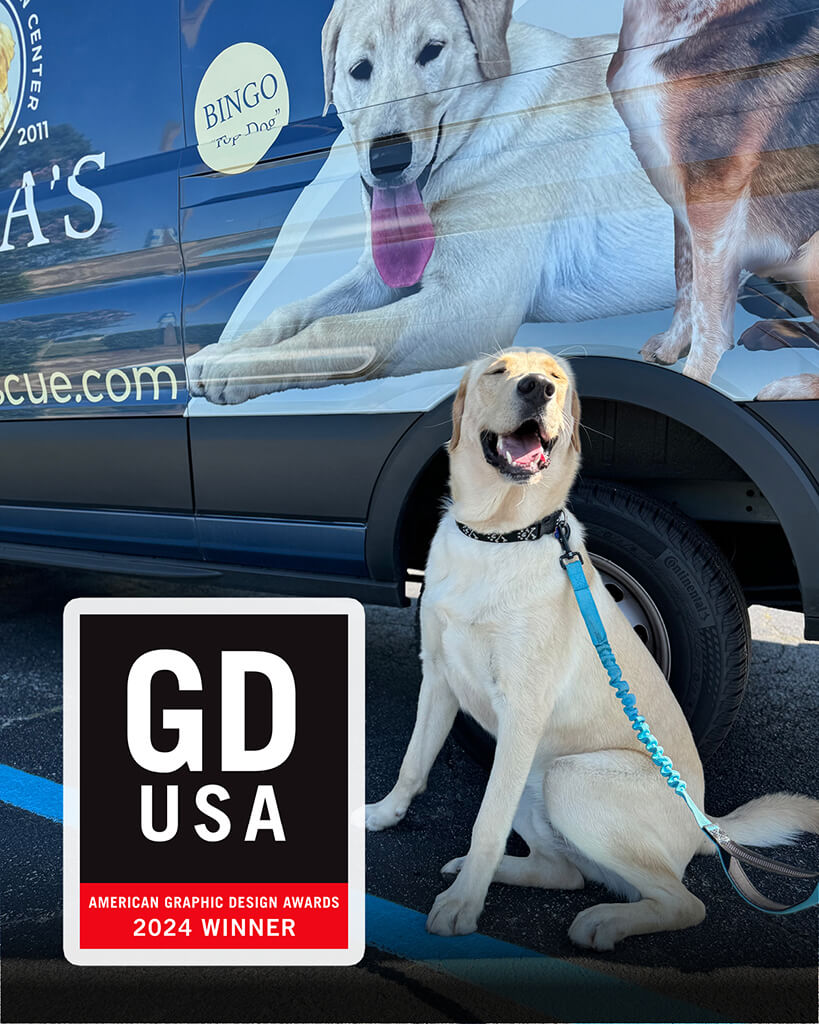 GDUSA award for Rebas van wrap. Bingo the golden lab is sitting in front of the van.