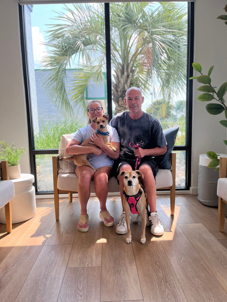These two people adopted a brown dog that looks just like his new senior friend.