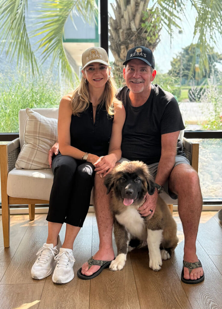 Couple pictured with one of the dumpling gang dogs, Teddy.