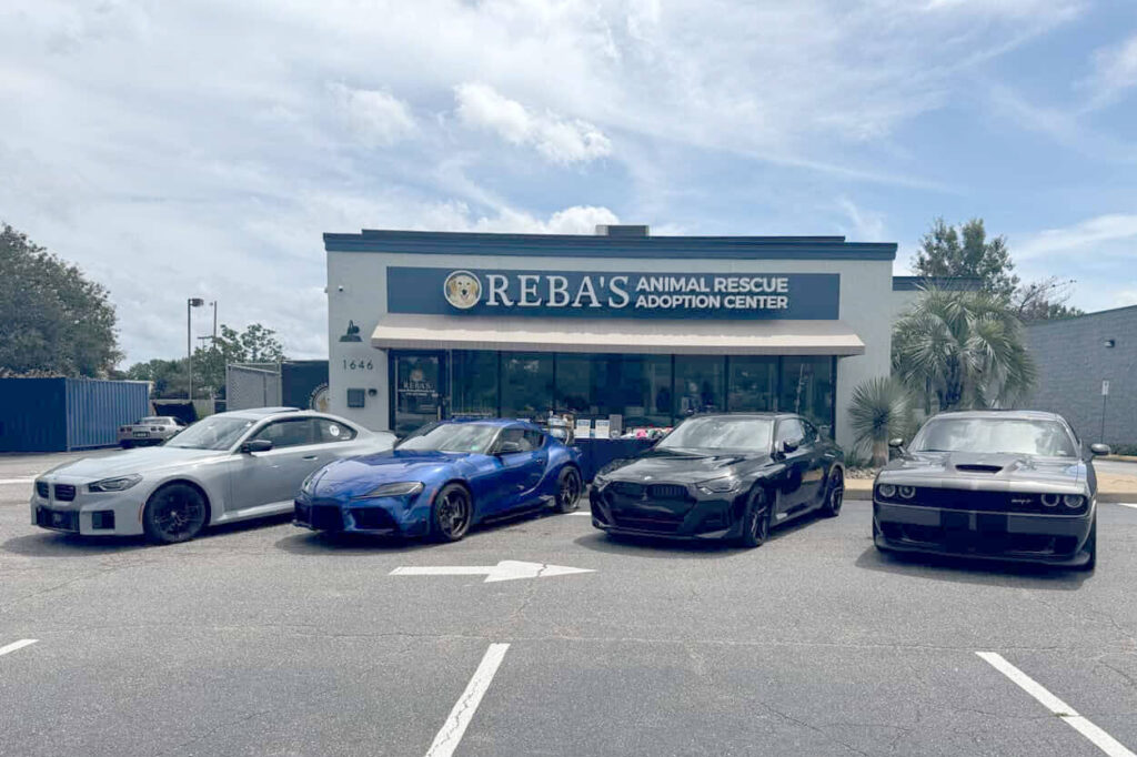 Four cars in front of Reba's facility