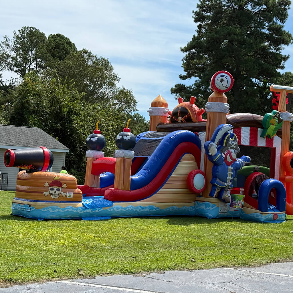 Family funday event with huge pirate ship bounce house