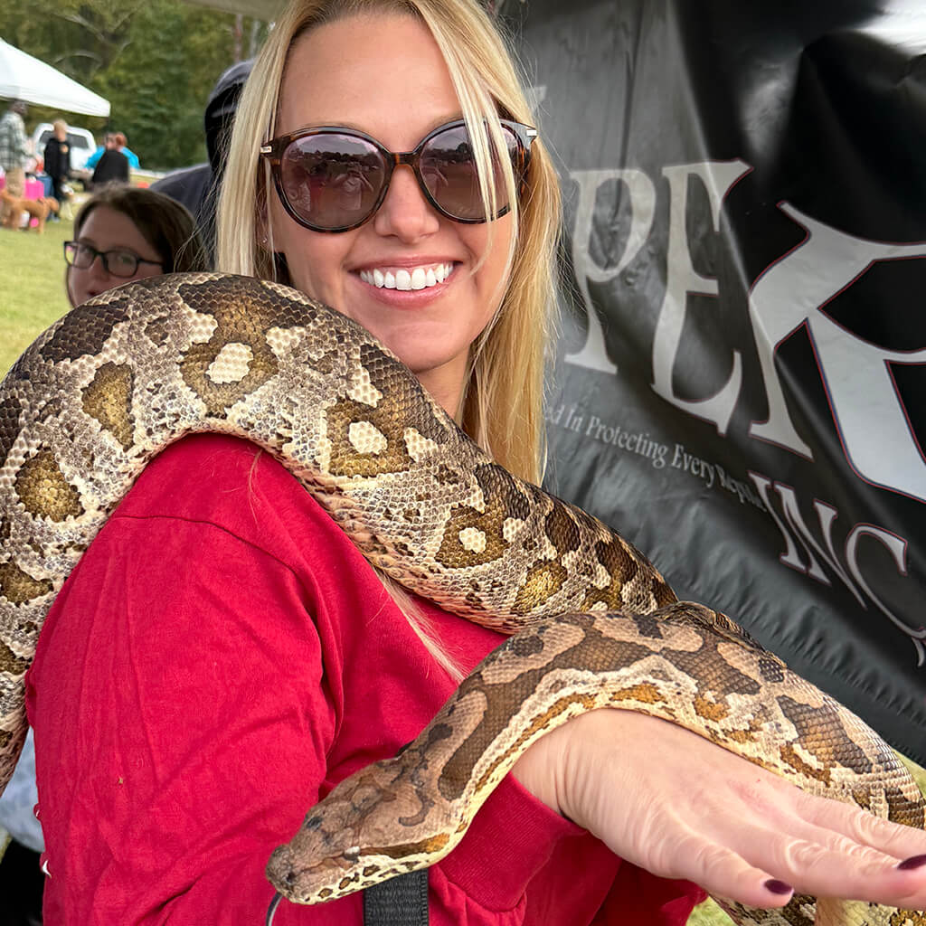 Meagan with large snake around her shoulders