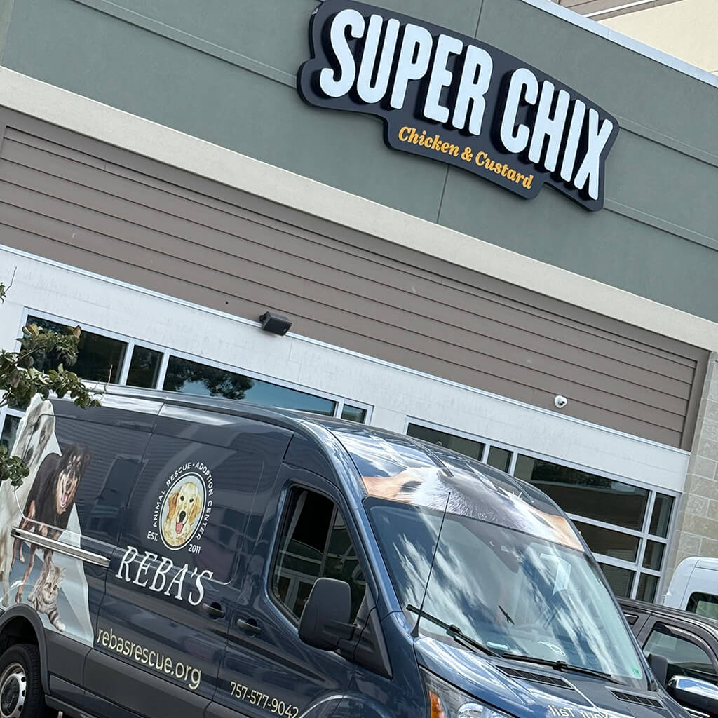 Super Chix Chicken & Custard storefront sign with Rebas van pulled out front