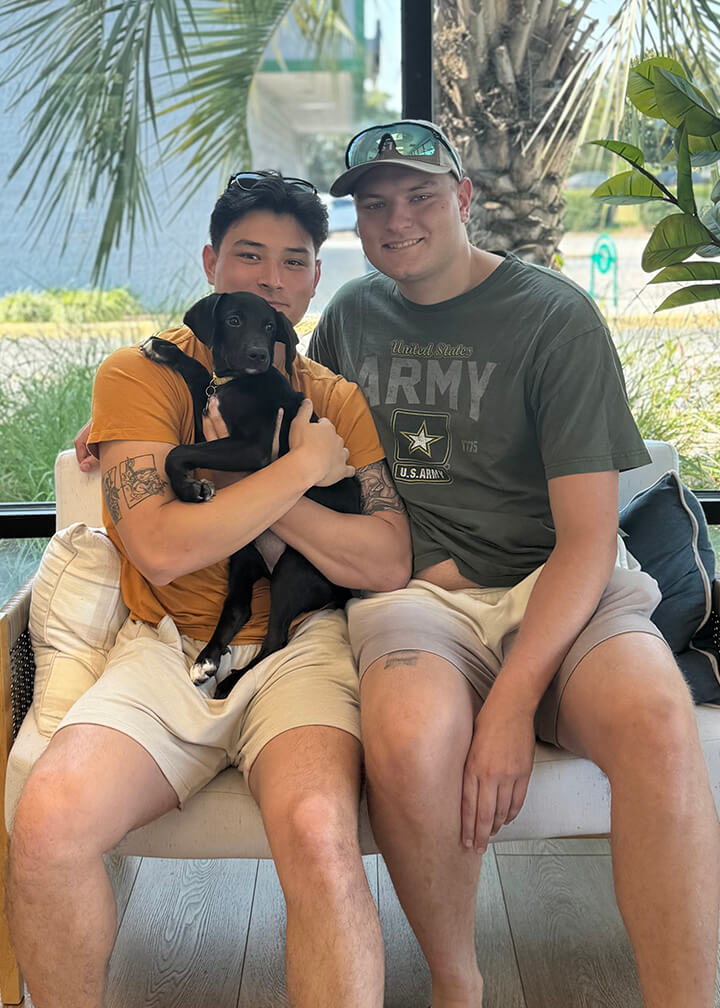 September 2025 adoption of Sneezy a black puppy