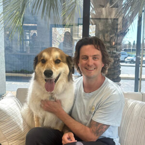 Staff photo of Blake with adoptable dog.