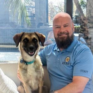 Staff photo of Rob with adoptable dog.