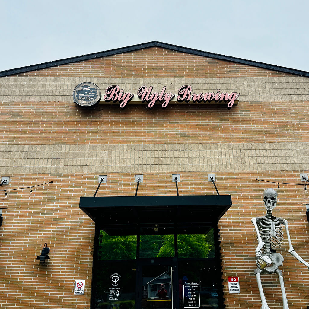 Big Ugly Brewing brick entrance with a skeleton to the right of the door