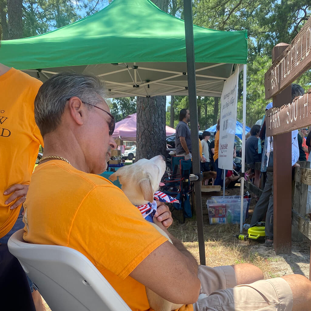 Volunteers give the dogs lots of attention